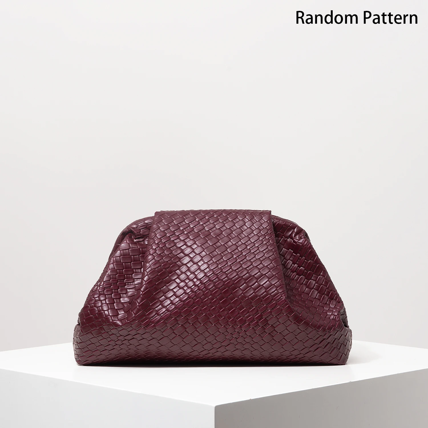 Burgundy woven leather clutch, front view