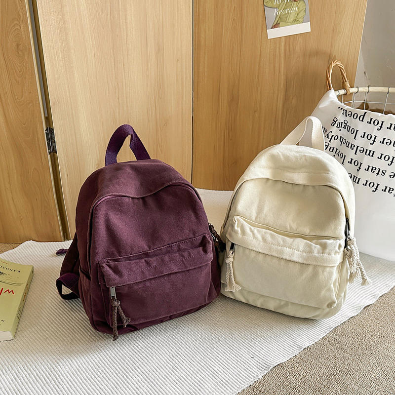 Small canvas backpack side view