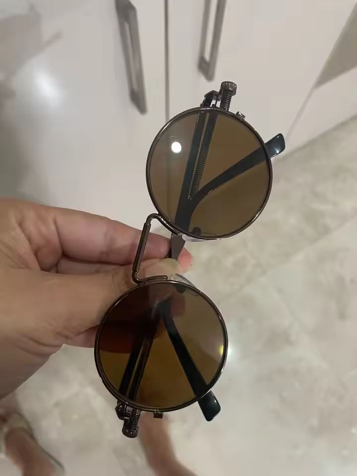 Round metal frame sunglasses close up