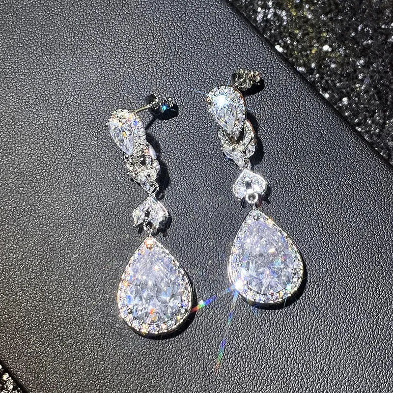 Sterling silver teardrop earrings flat lay