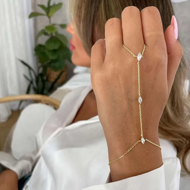 Thin chain finger bracelet close up