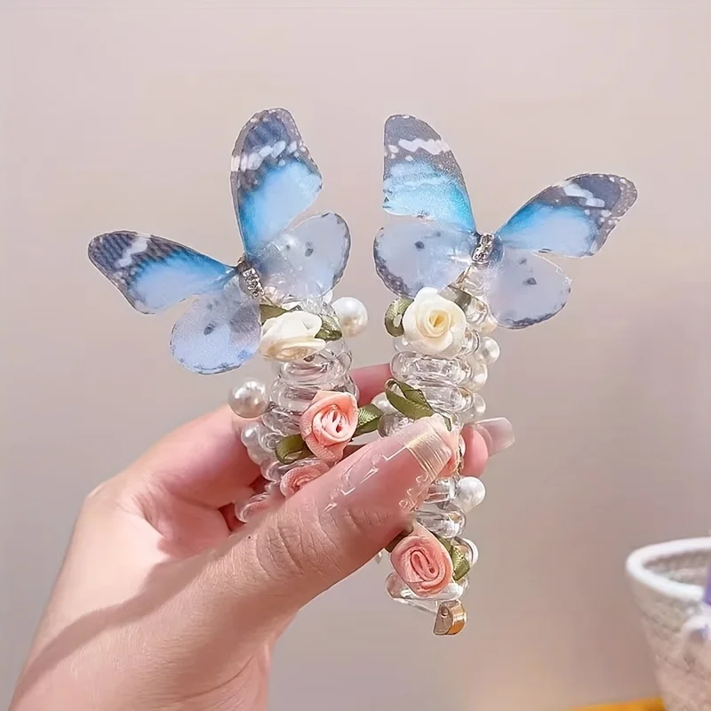 Blue butterfly hair clip pair with rose beads