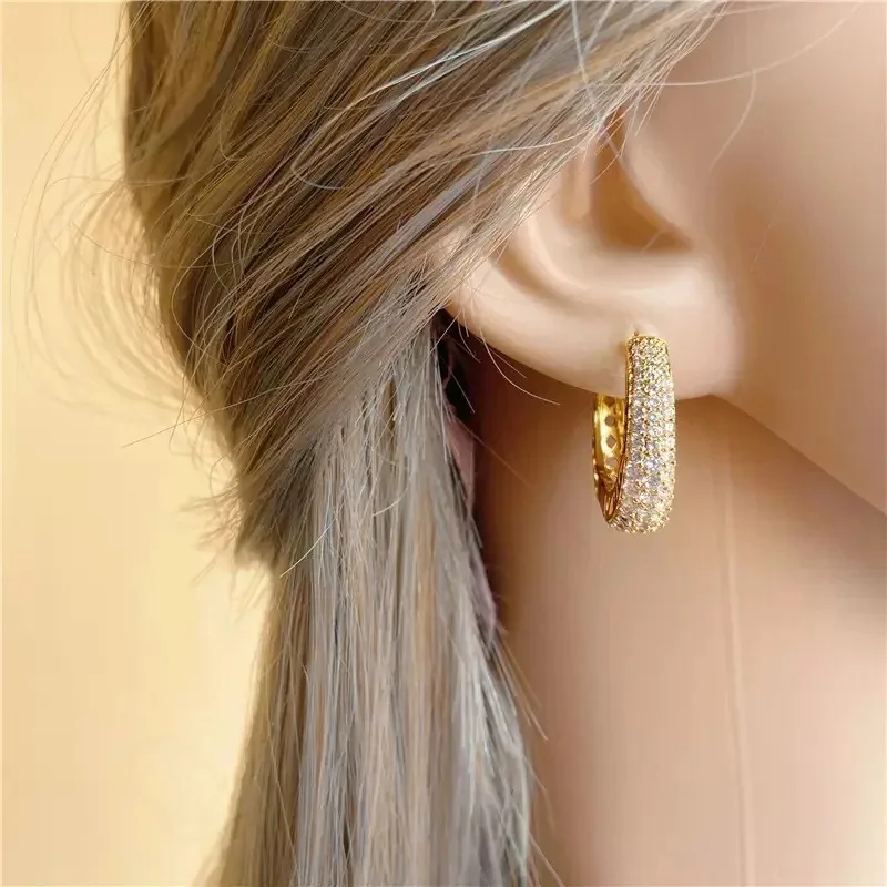 Woman wearing CZ hoop earrings