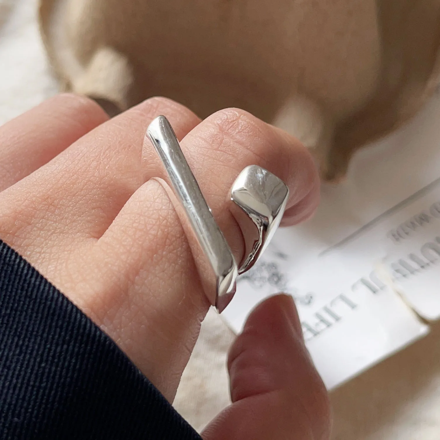 Geometric ring styled with other rings