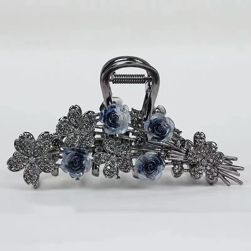 Rose crystal hair claw on white background showing comb teeth