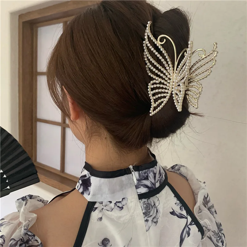 Butterfly hair claw clip on a low bun