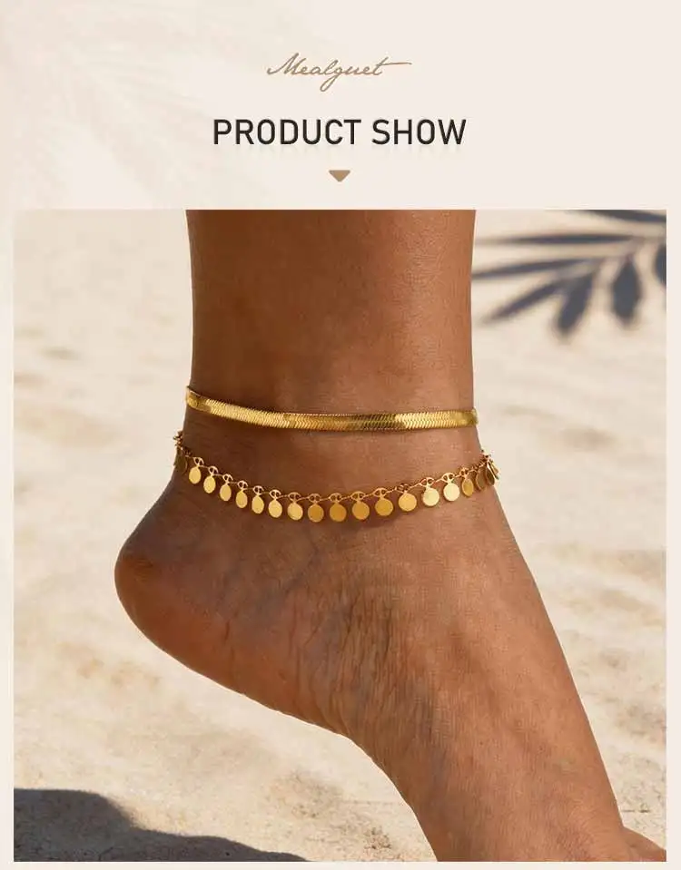 Layered gold snake chain anklet set worn on ankle