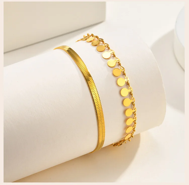 Woman wearing layered gold anklet