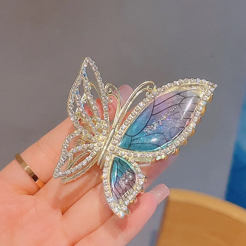 Close-up of blue butterfly hair claw clamp rhinestone detail