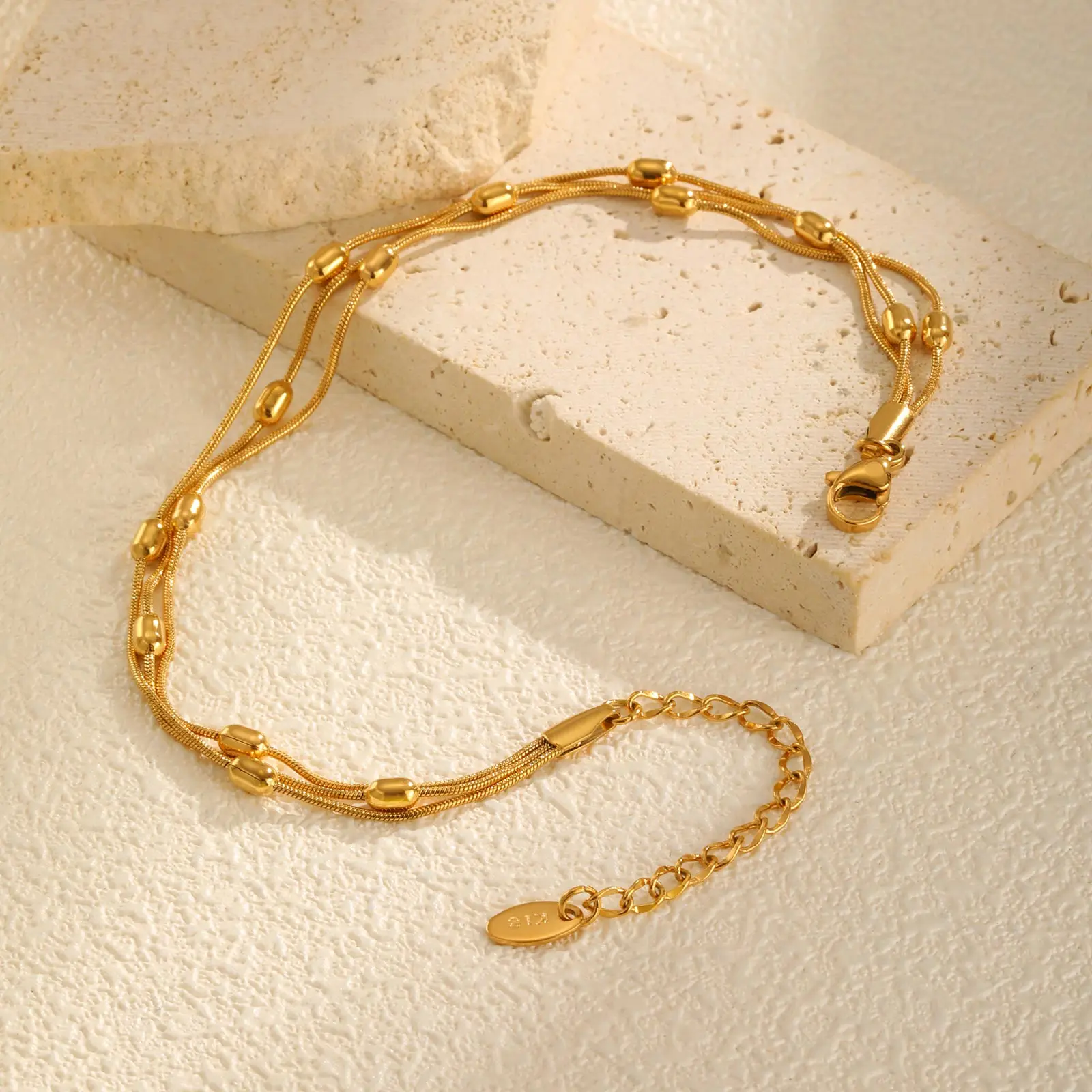 Three layer gold anklet chain close up