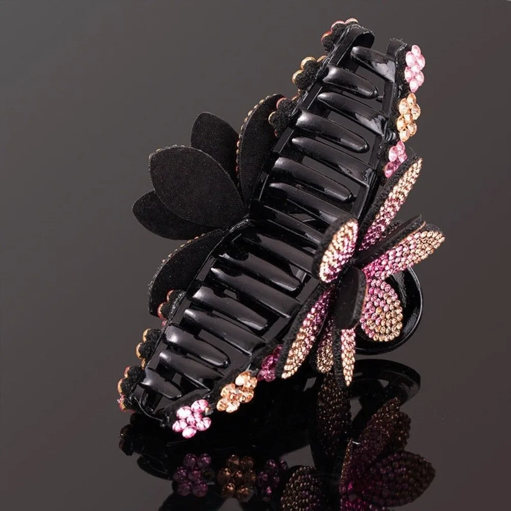Woman wearing rhinestone flower hair claw in an updo