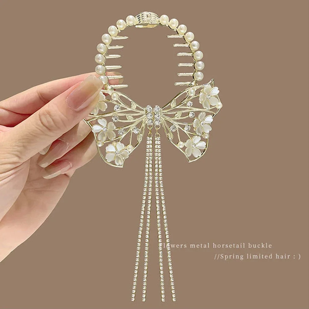 Pearl hair clip with gold bow and tassel
