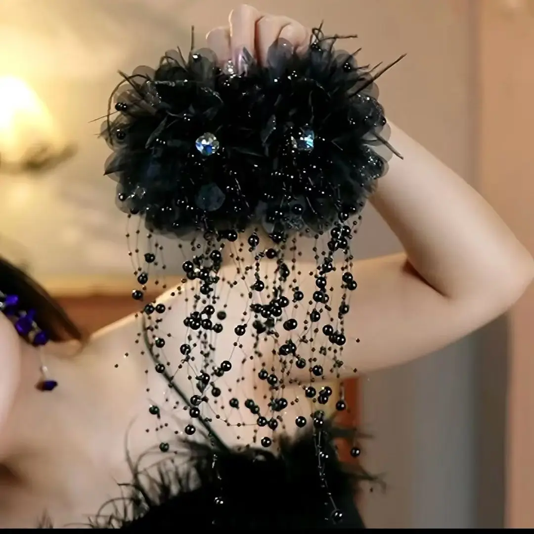 Black bead tassel flower hair clip close up