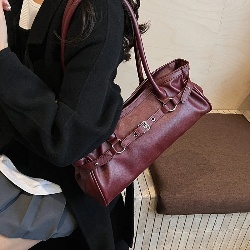 Close up of belt strap detail on leather tote bag