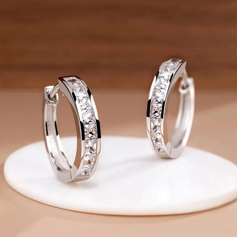 Sterling silver round hoop earrings with channel set CZ stones