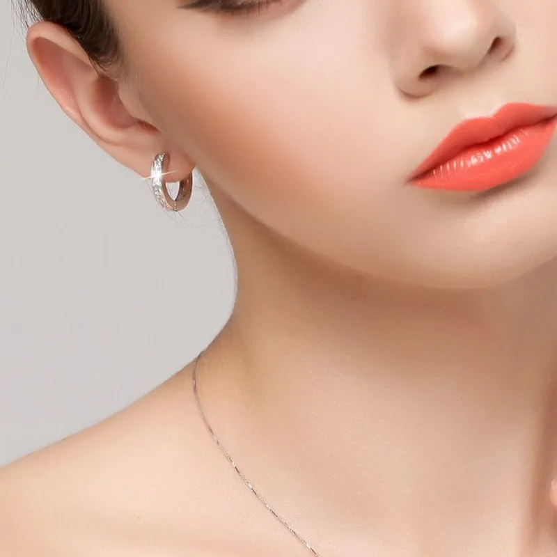 Sterling silver round hoop earrings styled with an outfit