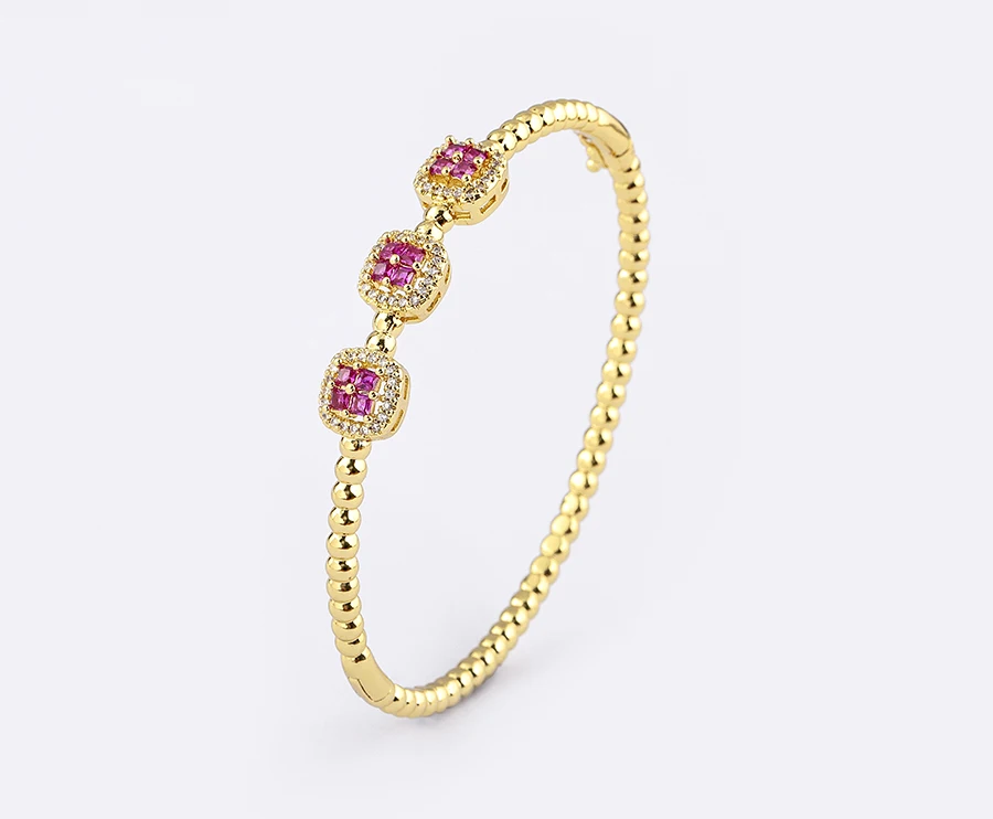 Woman wearing gold bangle bracelet