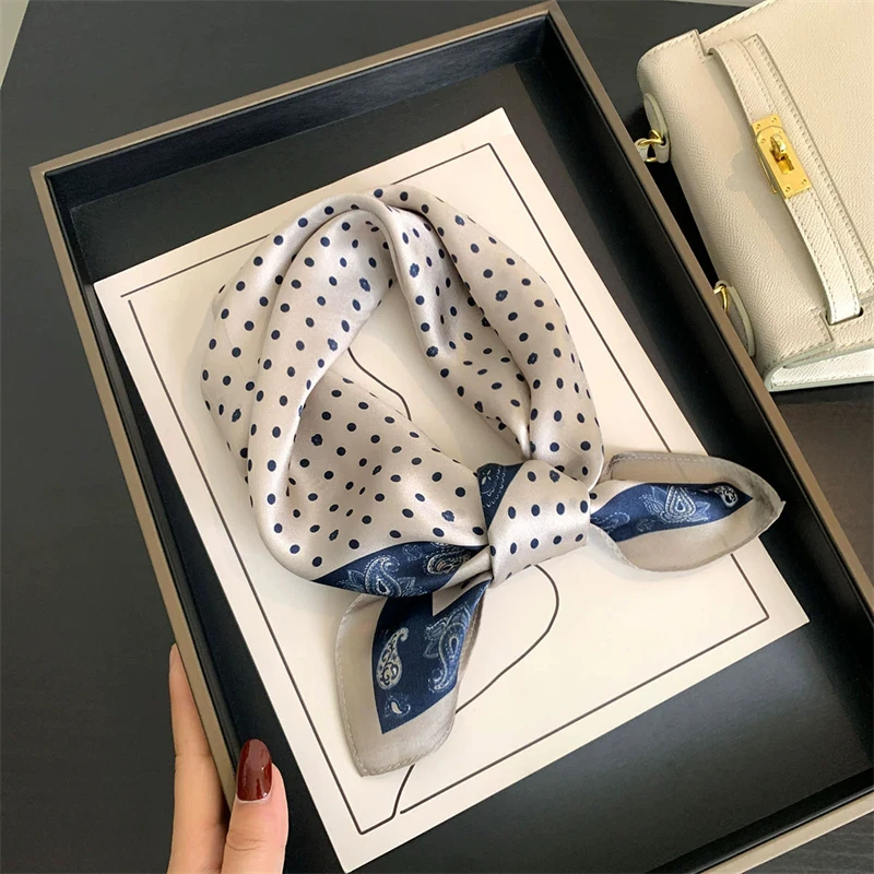 Silk scarf tied on a handbag handle