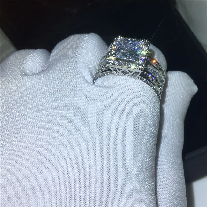 Halo zircon accents on promise ring band