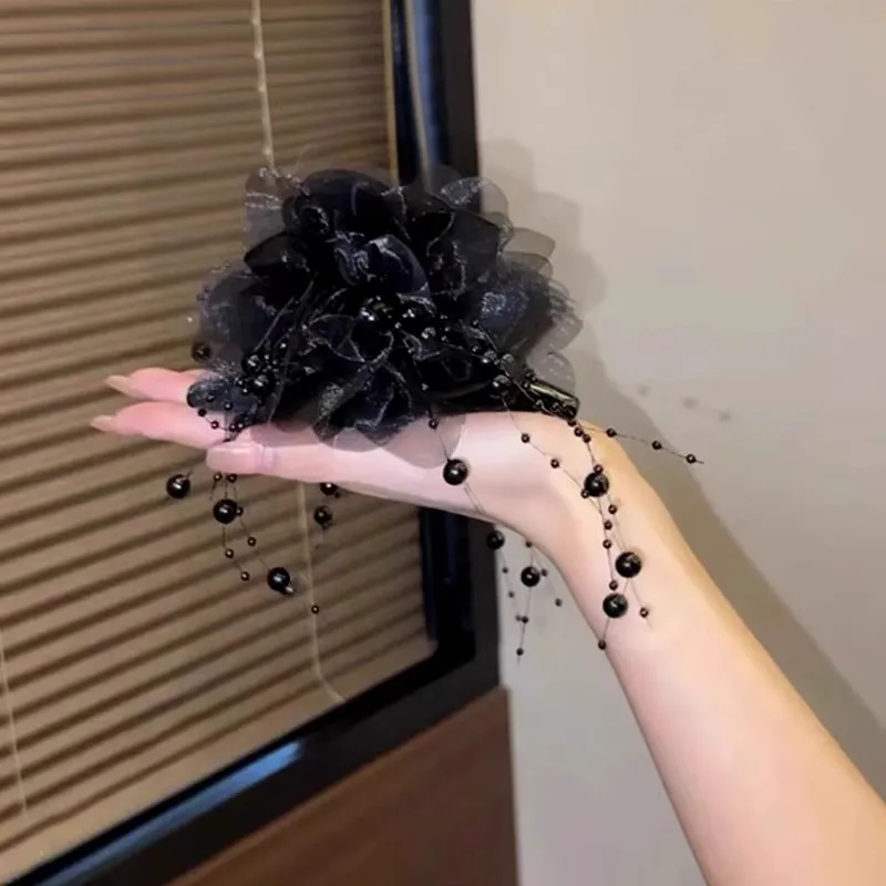 Vintage flower hair claw styled at the back of the head