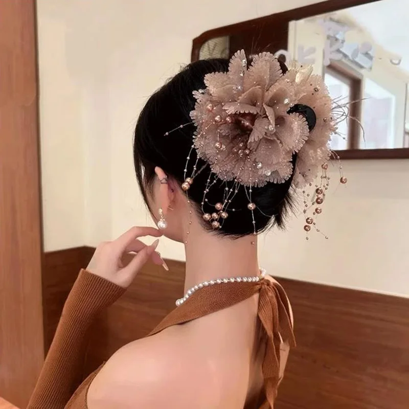 Vintage flower hair claw with pearl detail worn in hair