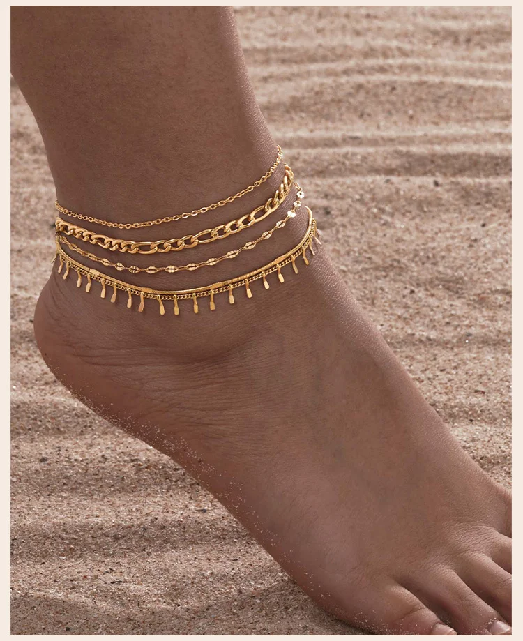 Three layer gold anklet chains close up on ankle