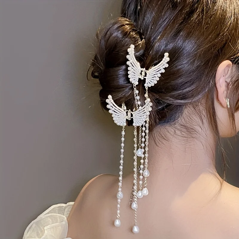 Pearl butterfly tassel hair clip worn in an updo