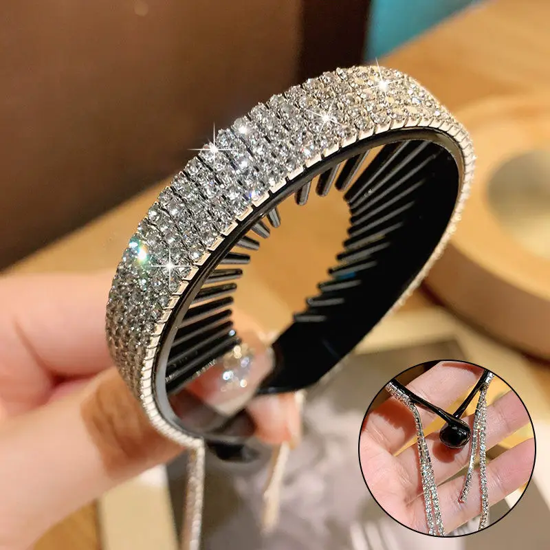 Rhinestone tassel ponytail hair claw held in hand