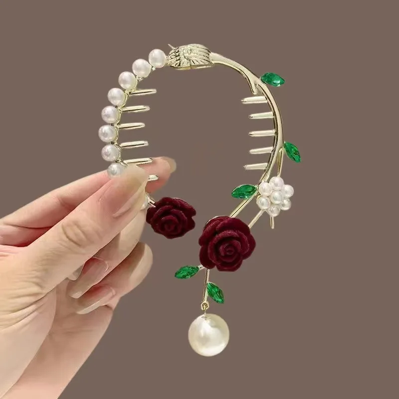 Dark hair comb with red flower rhinestone accents